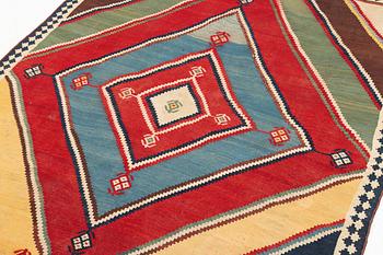 An antique Qashqai kilim rug, c. 380 x 148 cm.