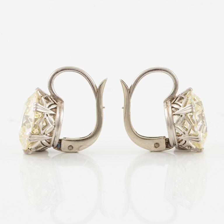 A pair of earrings in 18K white gold set with two old-cut diamonds.