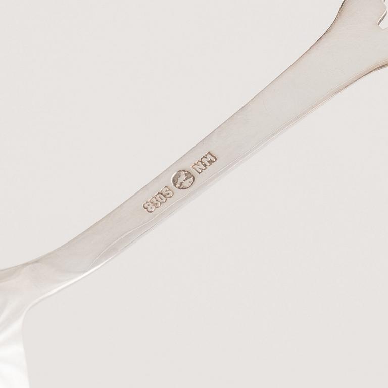 A 37-piece set of dessert cutlery, mostly the same model, with Swedish import marks.
