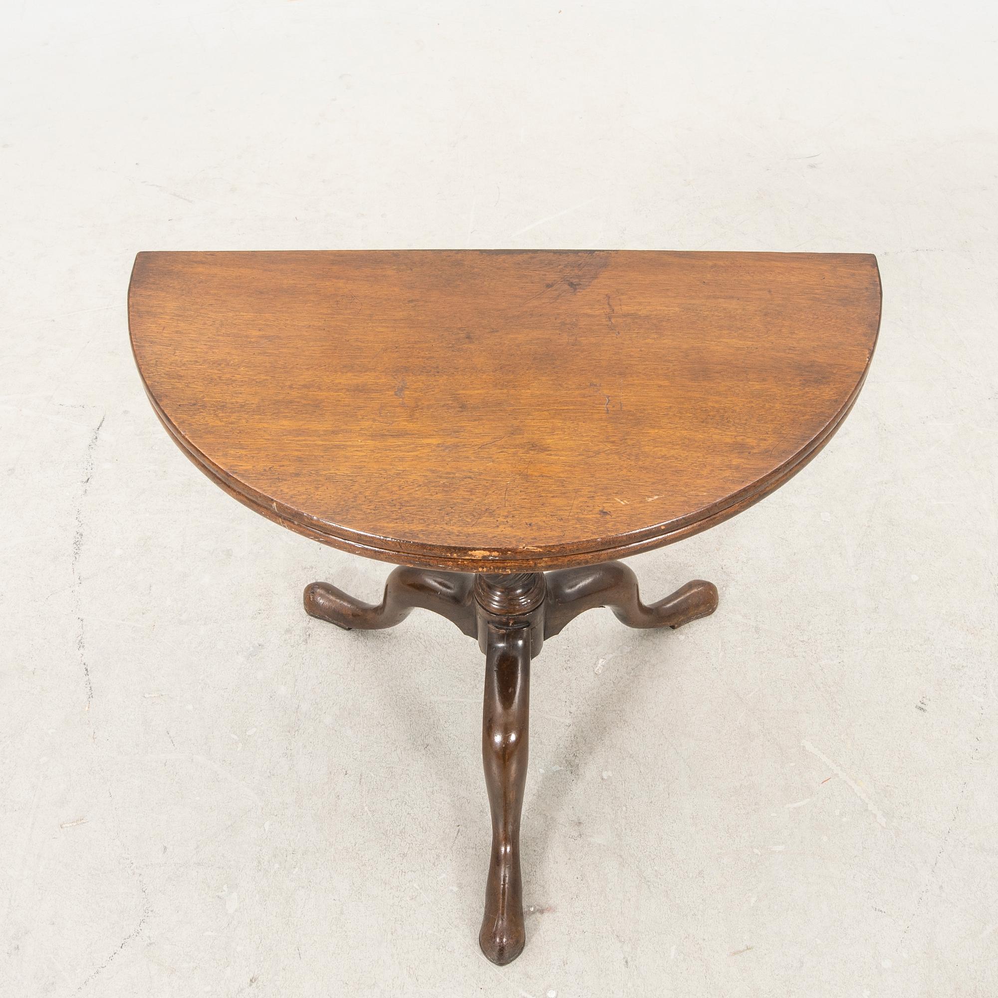 An English Queen Anne mahogany folding table 18th century.