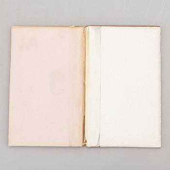 A keepsake book embellished by Ellen Jolin featuring a 'Santa Claus' figure.
