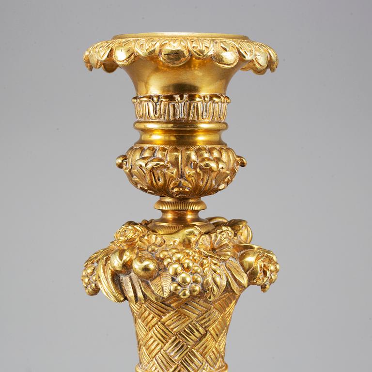 A pair of French Empire candlesticks, first half of the 19th century.