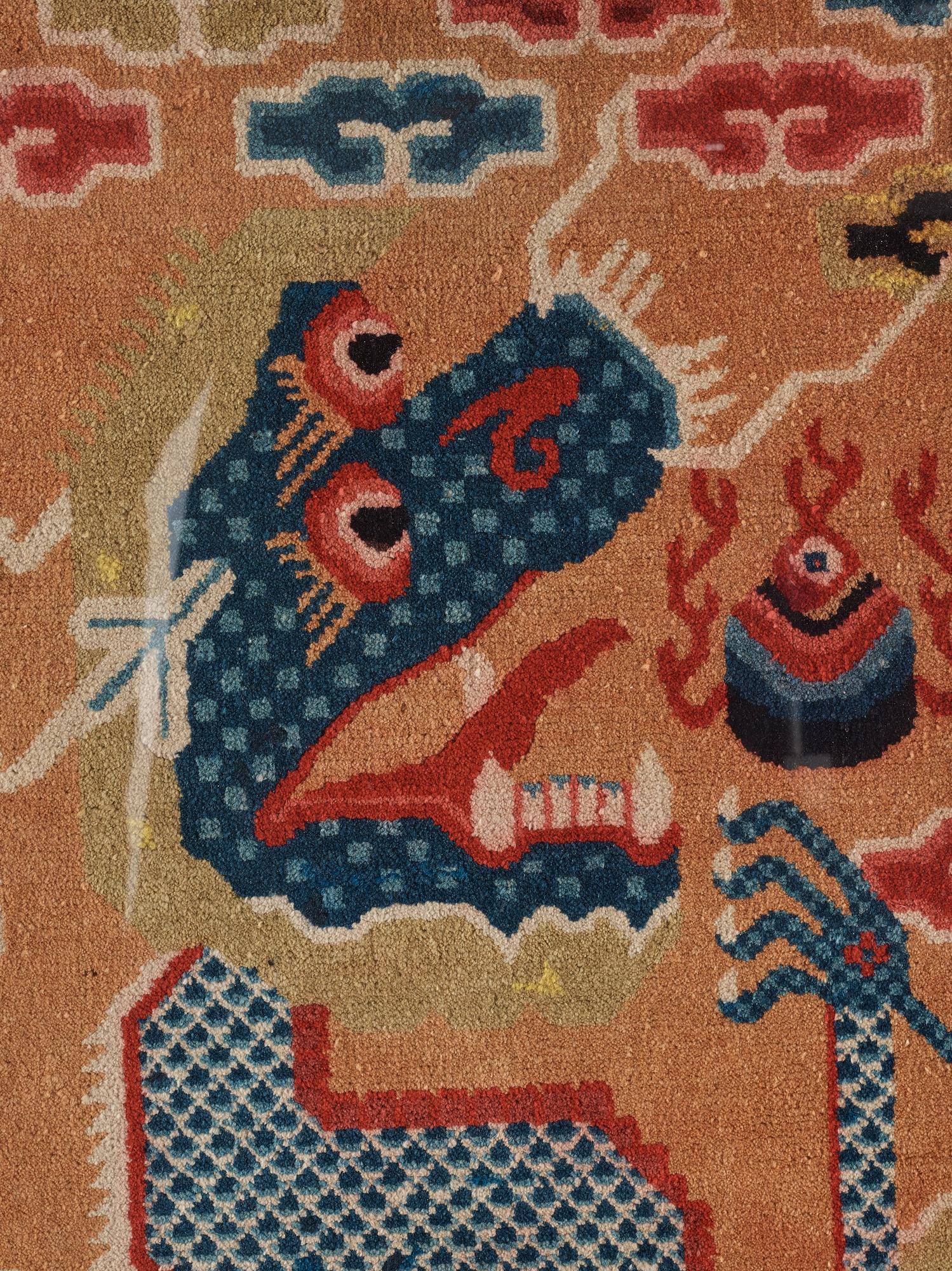 PILLAR RUG, FRAGMENT. Framed. Semi-antique China. 123 x 66 cm (with the frame 151 x 87,5 cm).