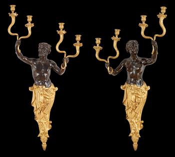 A pair of Louis Philippe 1830/1840's gilt and patinated bronze four-light wall-lights.