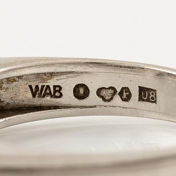 A W.A. Bolin ring in platinum with a pearl and round brilliant-cut diamonds.