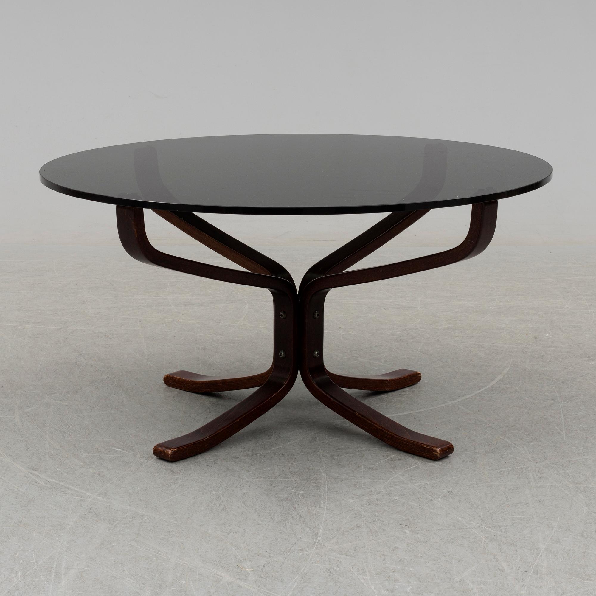 A pair of easy chairs and a table by Sigurd Ressel.
