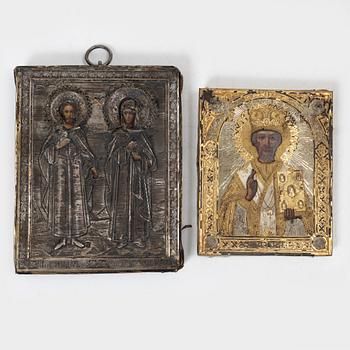 Two Russian icons with oklad, of which one in silver with stamps Moscow 1908-1926.