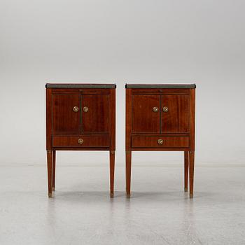 A pair of mahgany veneered bedside cabinets, early 20th Century.