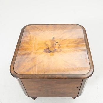Rotating table with fitted bar, 1930s/40s.