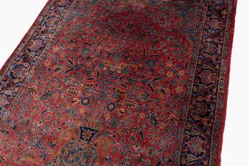 An antique Manchester Kashan rug, c. 197 x 126 cm.