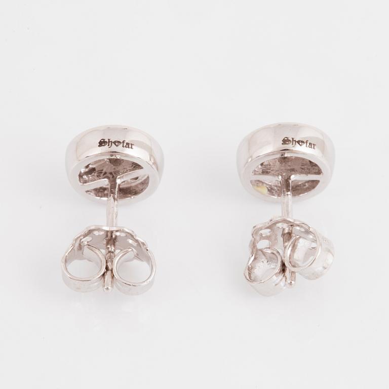 A pair of 14K gold earrings set with round brilliant-cut diamonds.