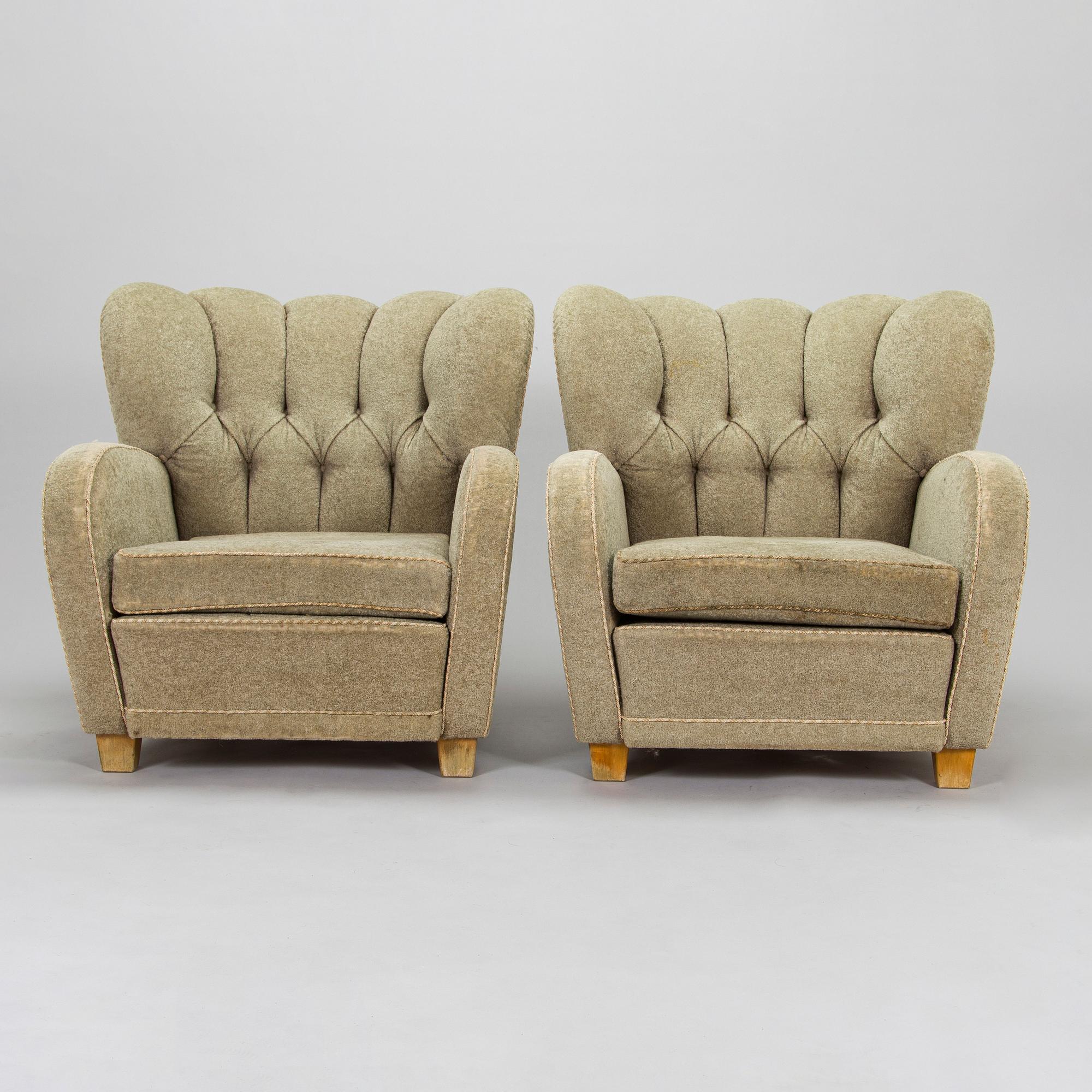 A pair of mid-20th century armchairs.