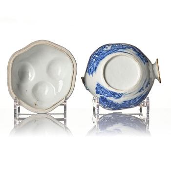 A Chinese blue and white 'pomegranate' tureen with cover and stand, Qing dynasty, Qianlong (1736-95).