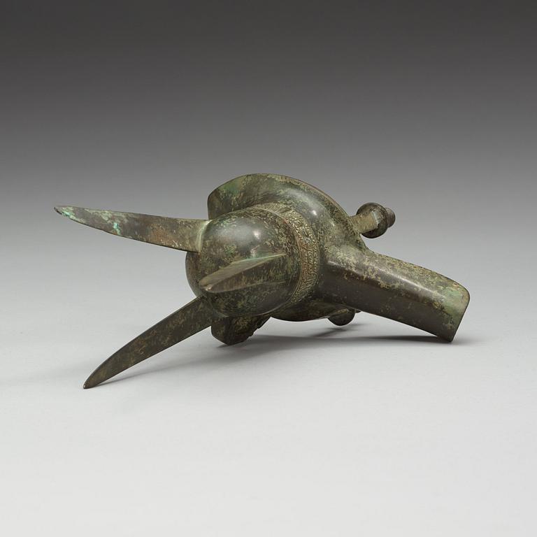 An archaic bronze ritual libation vessel (Jue), presumably Shang dynasty (1600 BC-1046 BC).