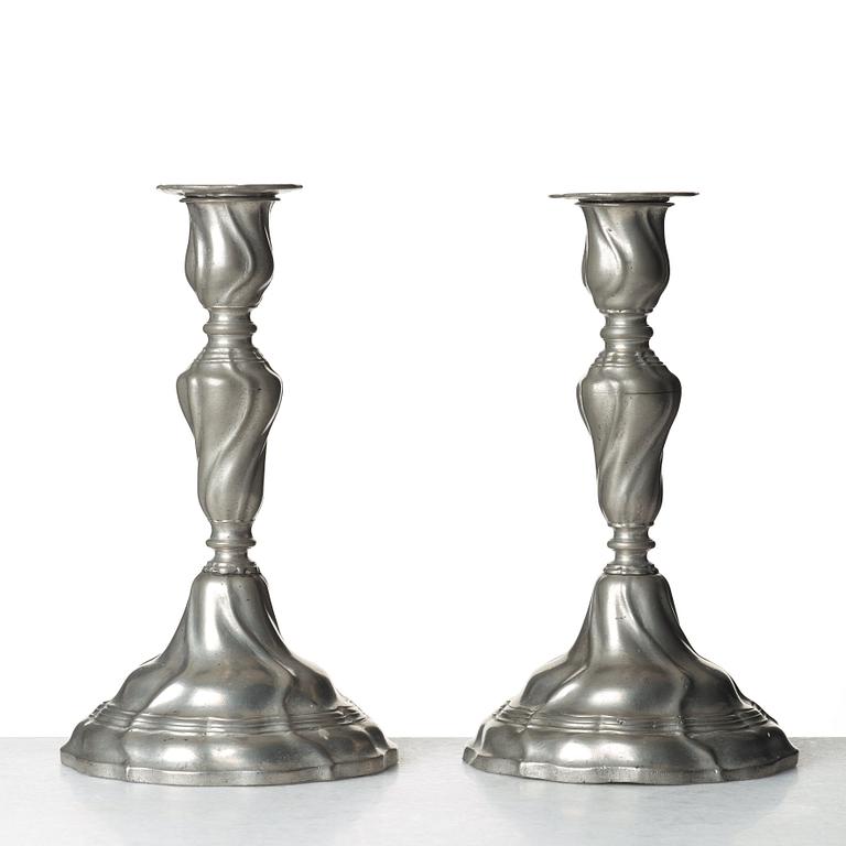 A pair of Swedish Rococo pewter candlesticks by E P Krietz, made in Stockholm 1772.