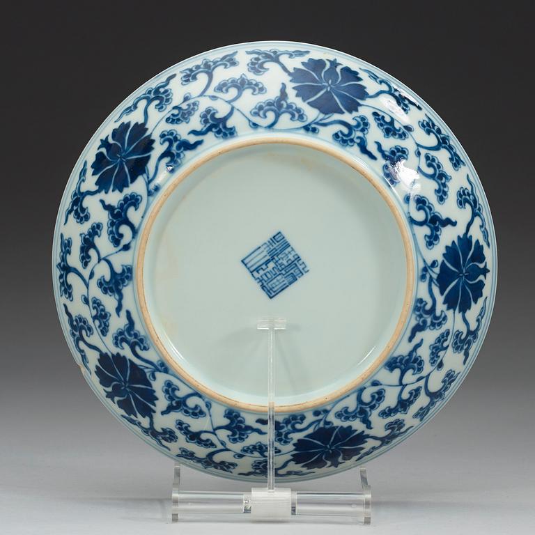 A set of four blue and white lotus dishes, Qing dyanasty with Qianlong sealmark.
