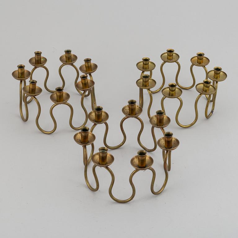 LARS HOLMSTRÖM, Three brass candelabra, Arvika, mid 20th Century.