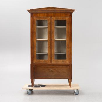A mahogany veneered book cabinet. 19th Century.