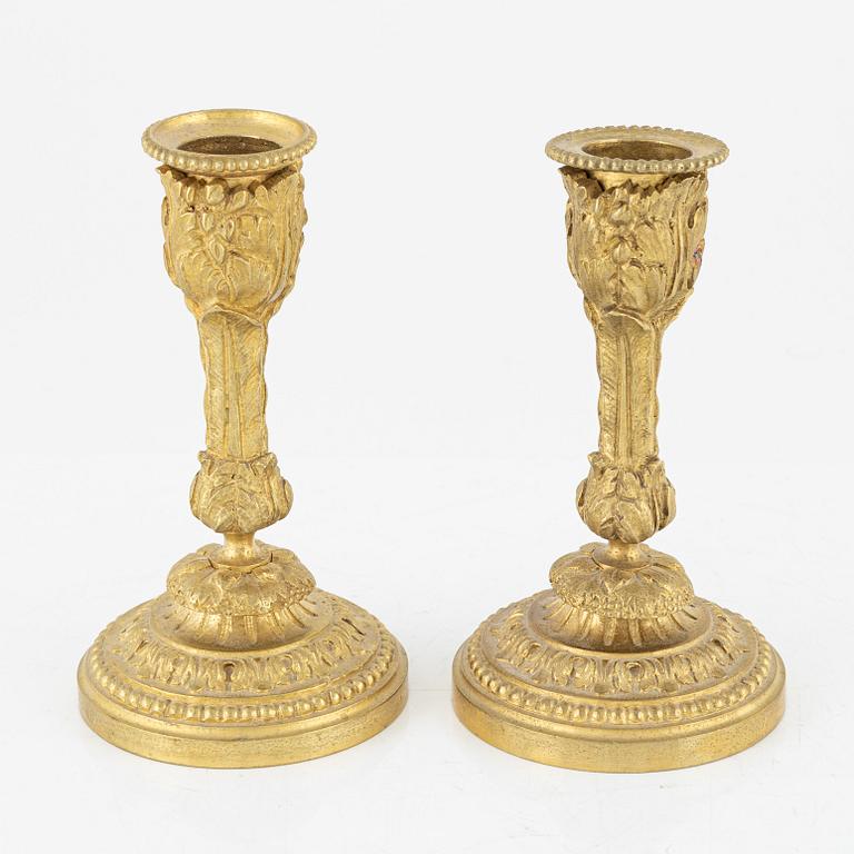 A pair of ormolu candlesticks, late 19th Century.