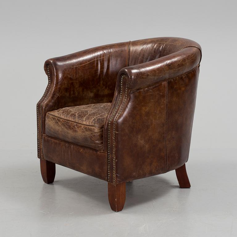 A leather club lounge chair by Newport, ca 2000.