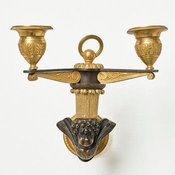A pair of Empire patinated and ormolu two-branch appliques attr. to C. Galle (bronzier in Paris 1786-1815).