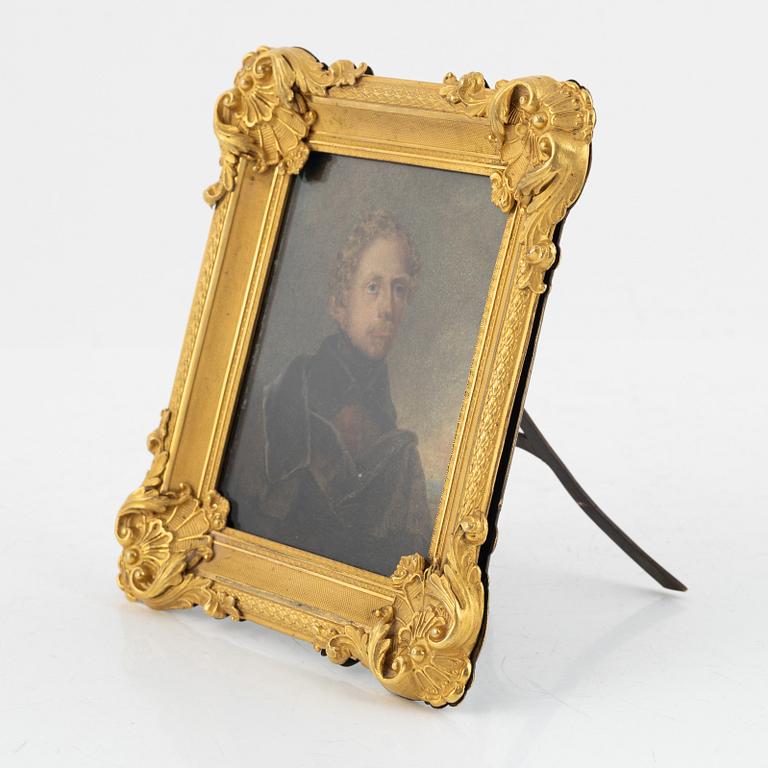 A late Empire ormolu frame with an officer's portrait, 1830's/40's.