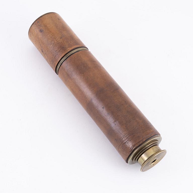 A brass spotting scope from I. H. Steward, London, circa 1900.