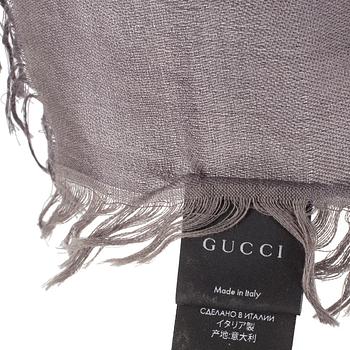 A shawl by Gucci.