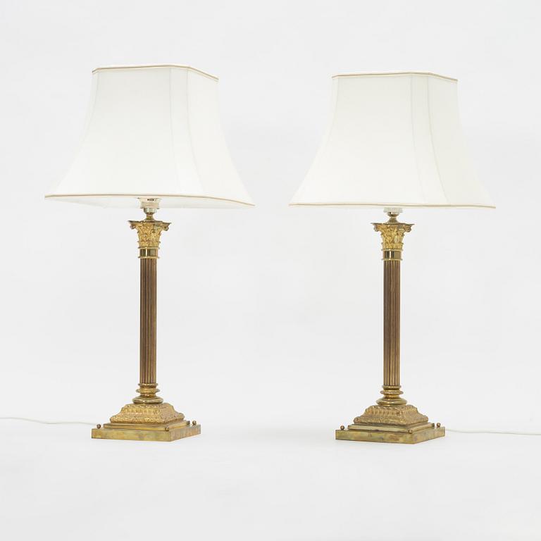 A pair of brass Empire style table lamps, 20th Century.