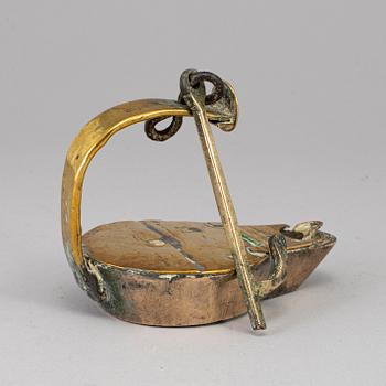 An 18th century bronze oil lamp.