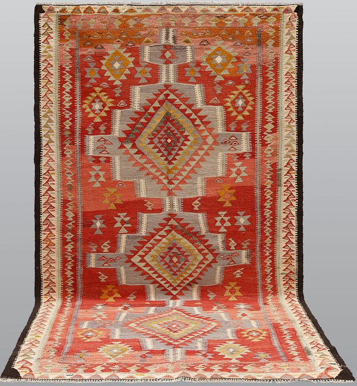 A Persian nomadic kilim, approximately 260 x 150 cm.