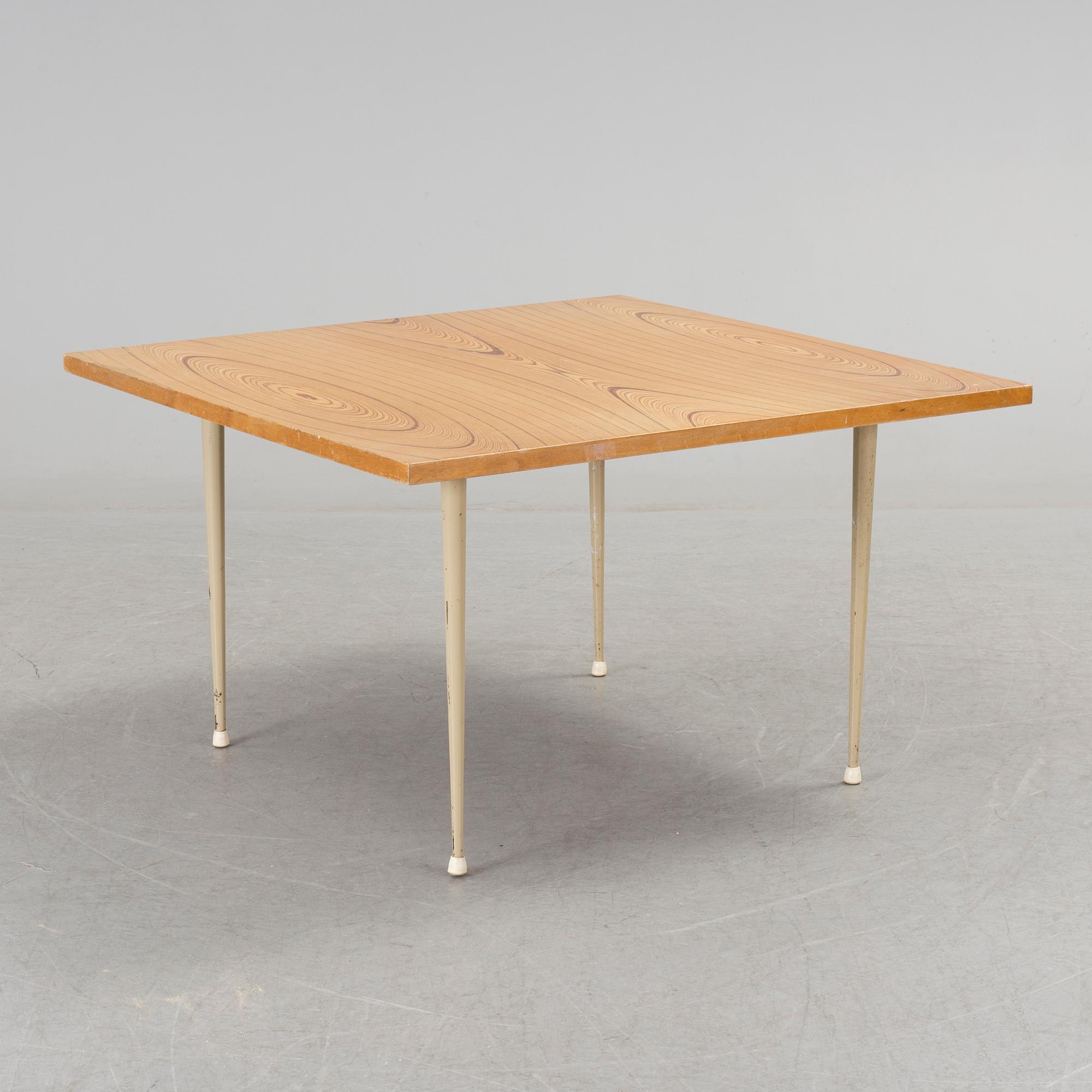 A coffee table marked Tapio Wirkkala, Asko, Made in Finland.