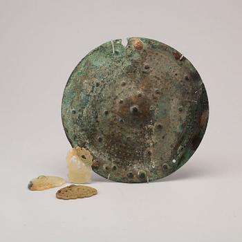 Three 20th century stone objects, with one bronze shield.