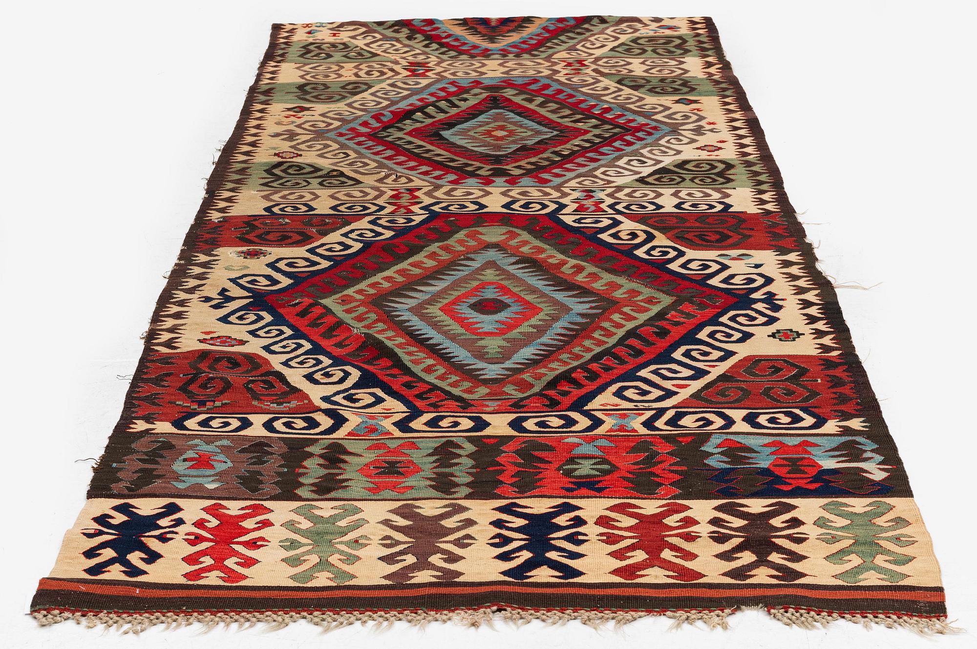 An antique Central Anatolian kilim, c. 273 x 101 cm.