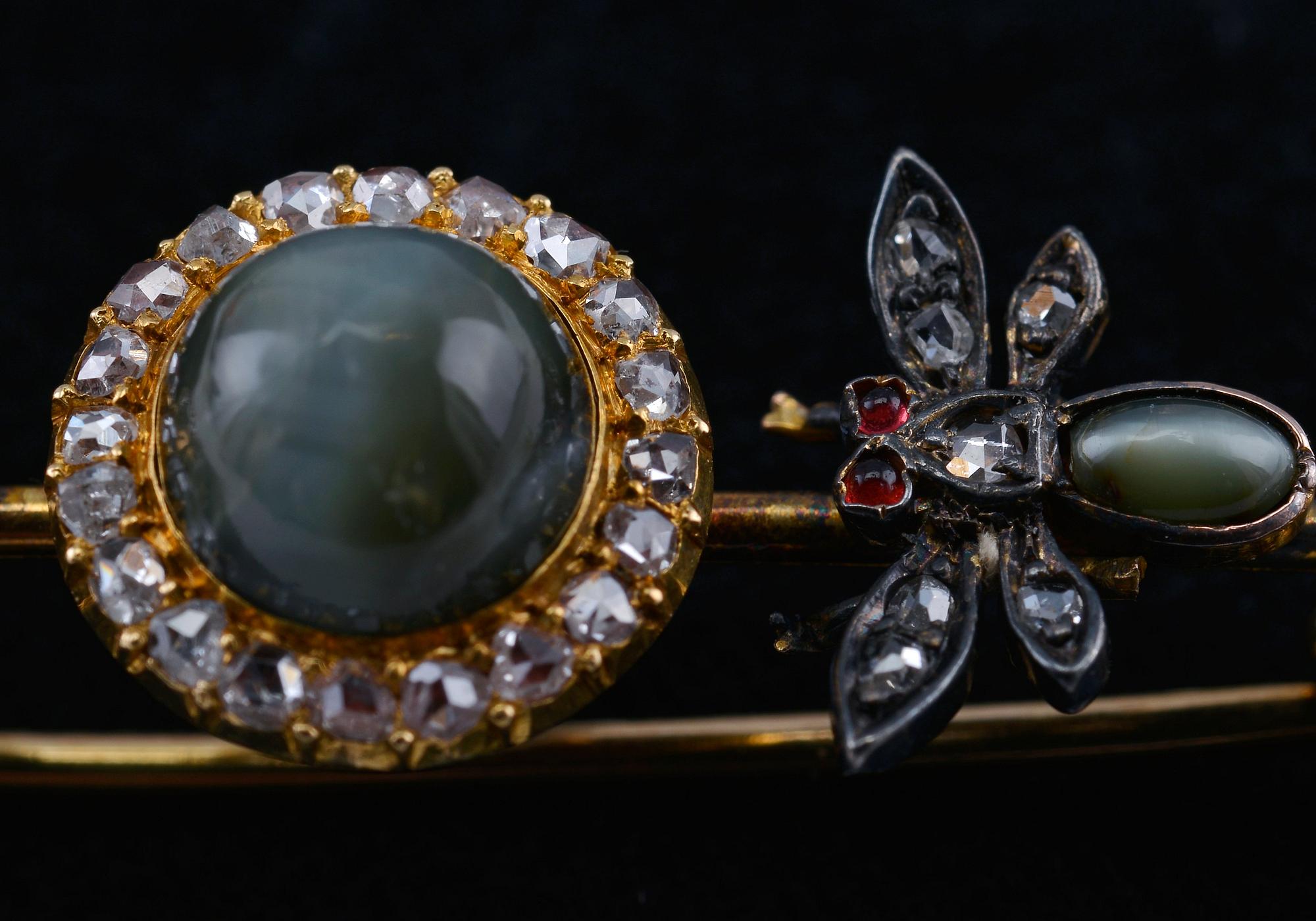 BROSCH, krysoberyllkattöga. Antik- och rosenslipade diamanter ca 0.65 ct. 18K guld. Vikt 8,4 g.