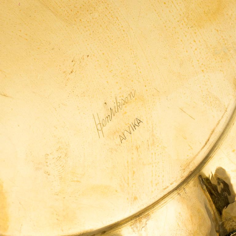 A set of four brass plates by Ture Henrikson, Arvika.