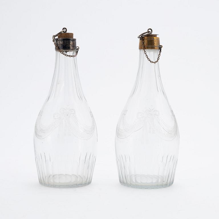 A pair of late gustavian glass and silver vinegar bottles, circa 1800.