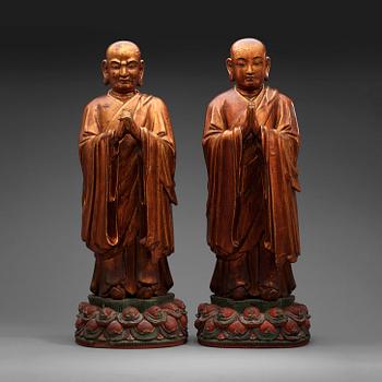 143. Two gilt lacquered figures of lamas, Ming dynasty (1368-1644).