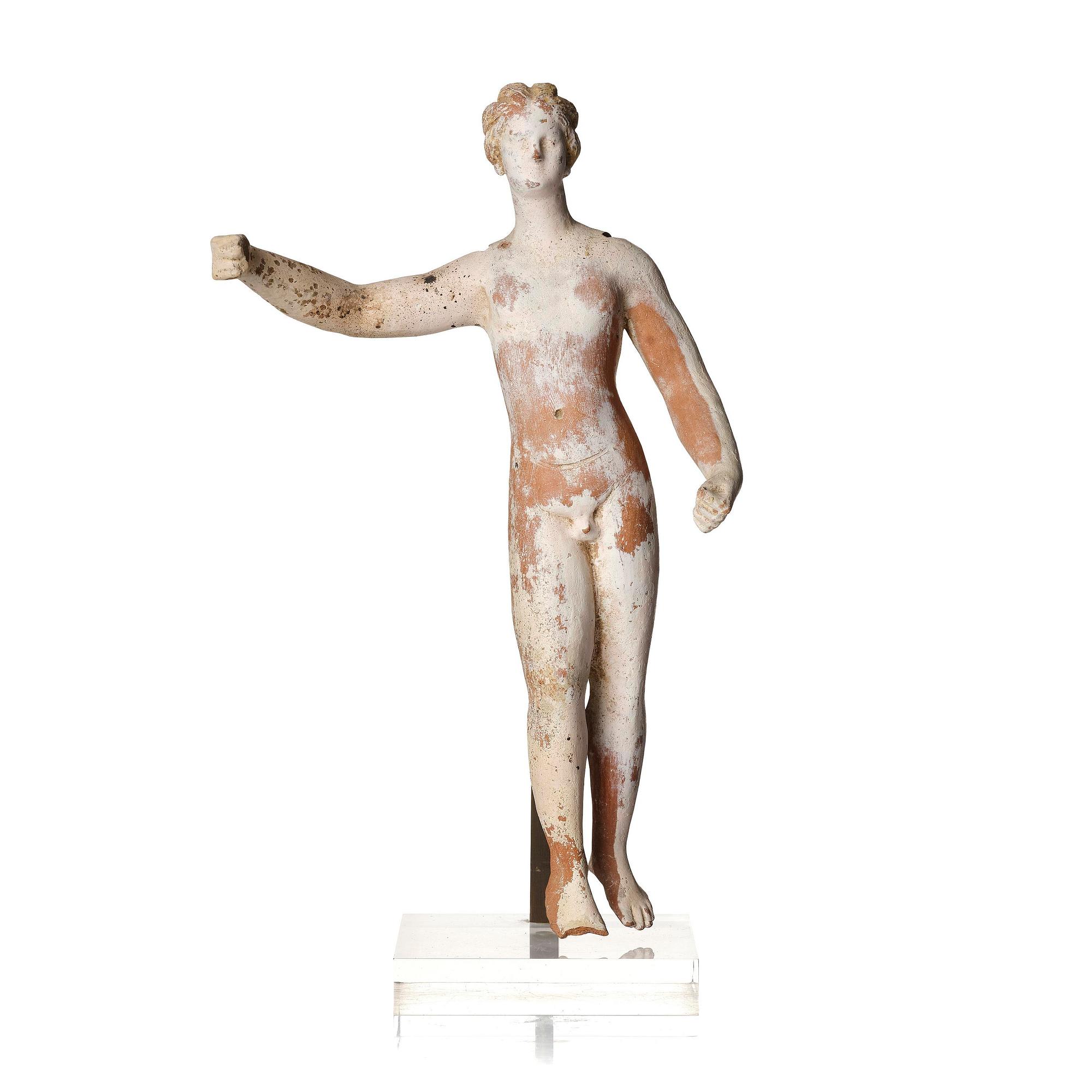 A Greek terracottta scultpure of Eros, presumably Hellenistic period, Canosa,  circa 3rd Century B.C..