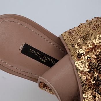 LOUIS VUITTON, a pair of gold spangled boots with peep-toe.