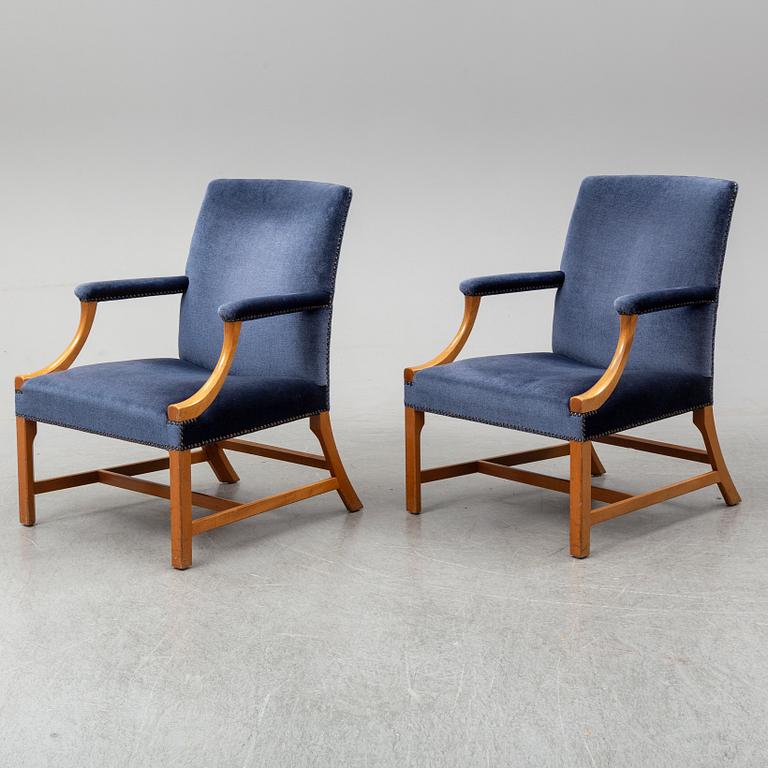 A mid 20th Century pair of oak armchairs attributed to Carl Malmsten.