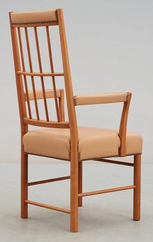 A Josef Frank cherry and beige leather armchair, Svenskt Tenn 2007, model 652.
