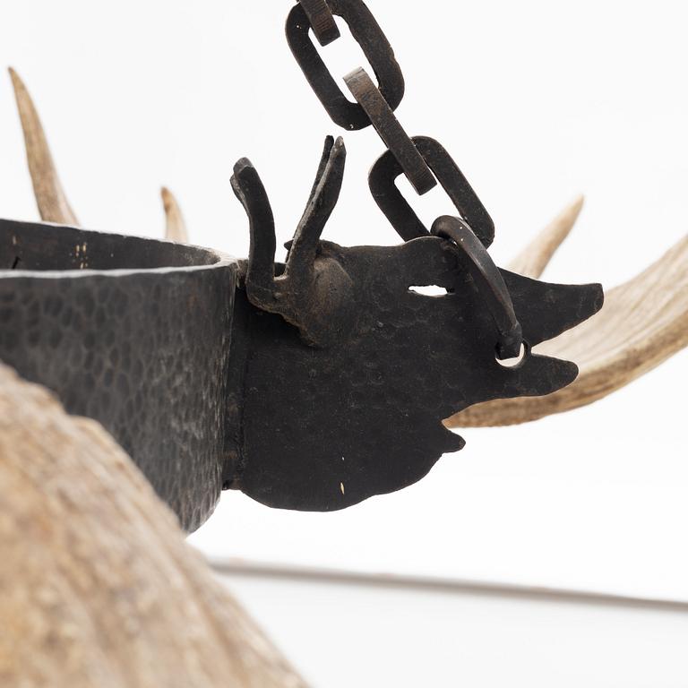 A moose horn and cast iron chandelier from around 1900.