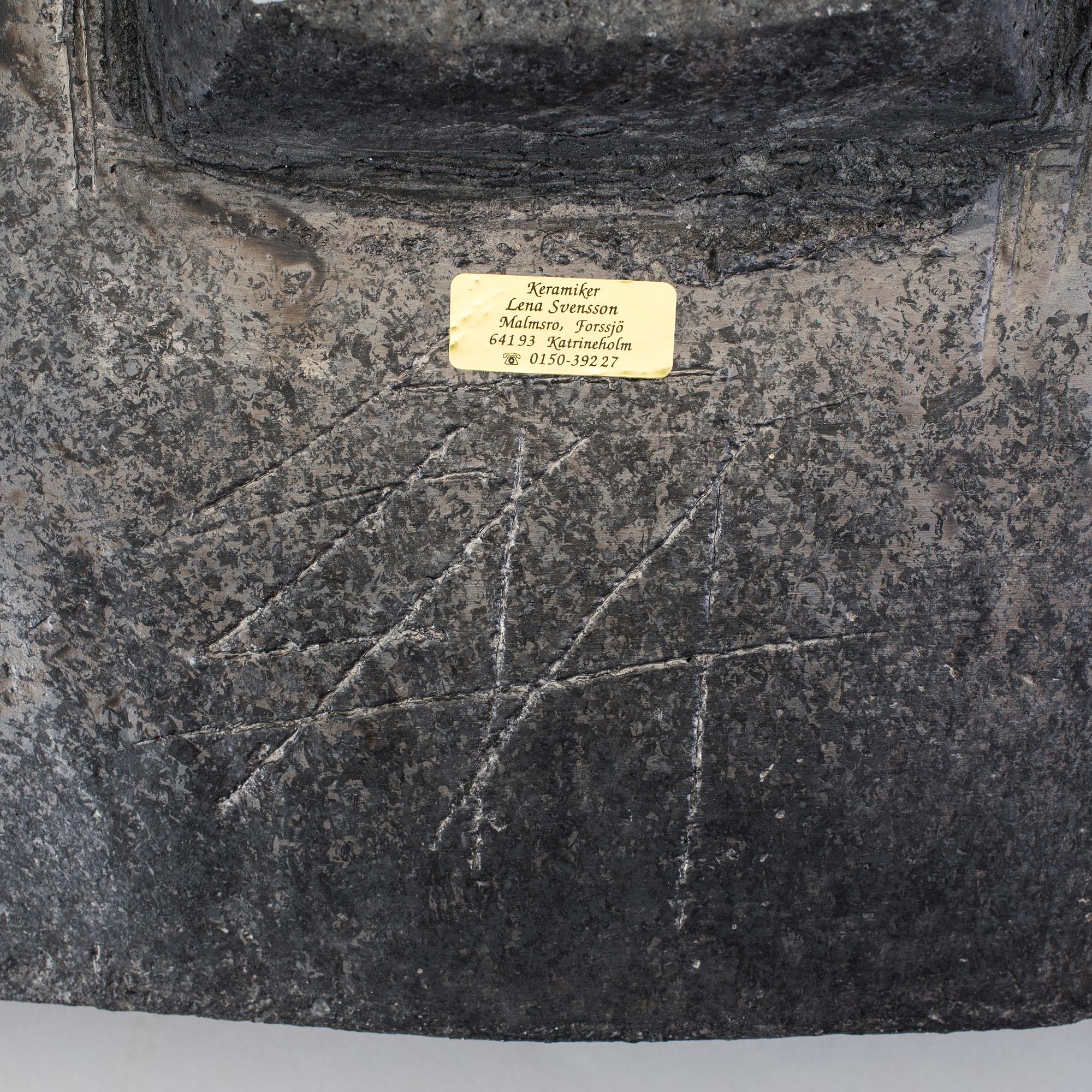 A barrel by LENA SVENSSON, raku burned pottery, sined.