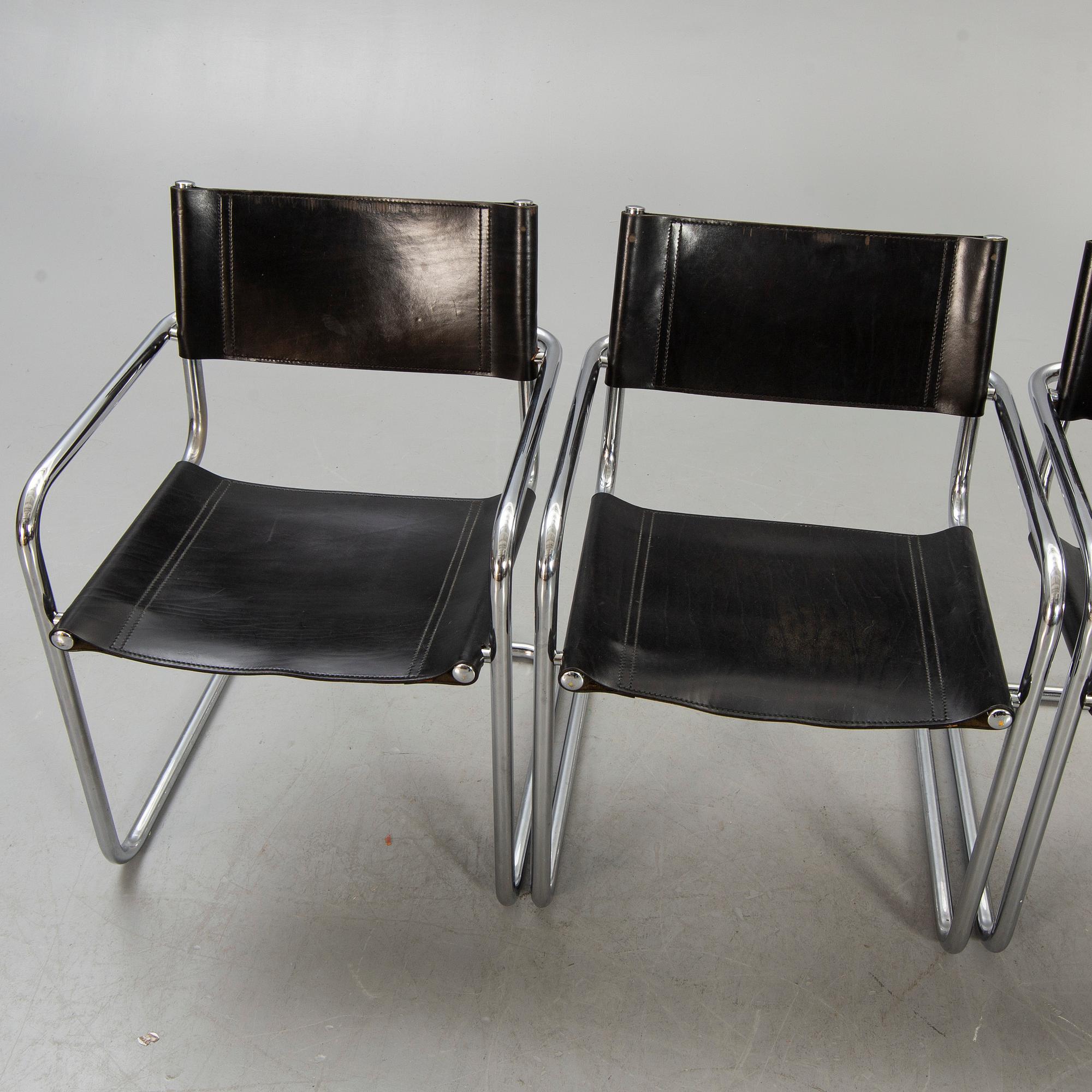 A set of four Italian chrome and leather chairs later part of the 20th century.