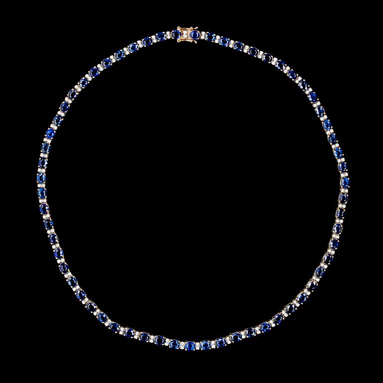A blue sapphire and diamond necklace, tot. app. 1.30 cts.