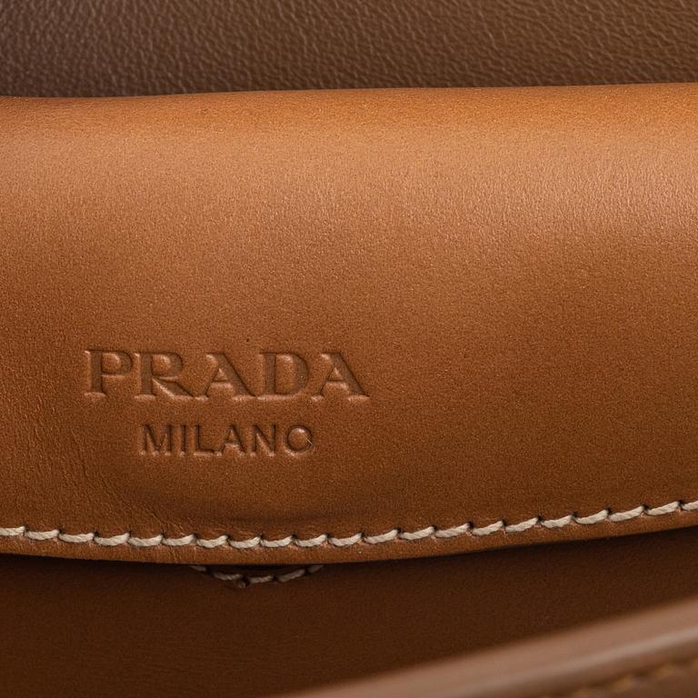 Prada, a leather bag.