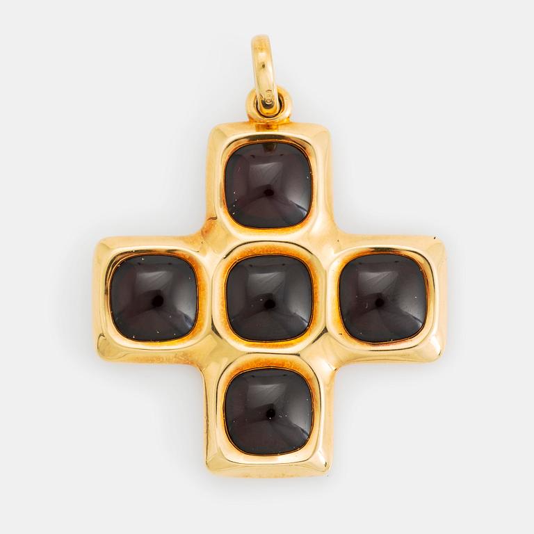 An 18K gold and garnet Pomellato cross.