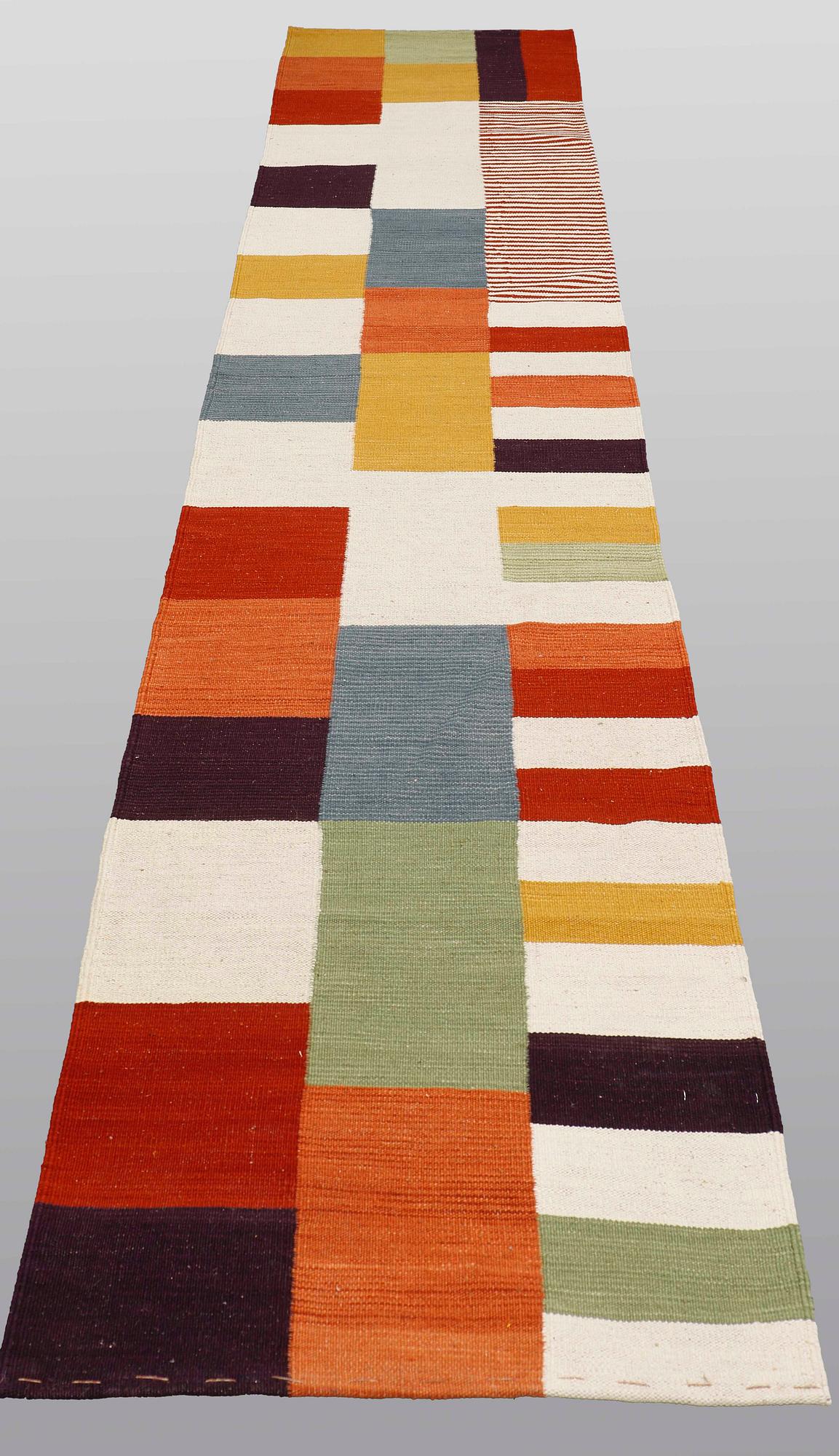 A runner, flat weave, ca 344 x 77 cm.