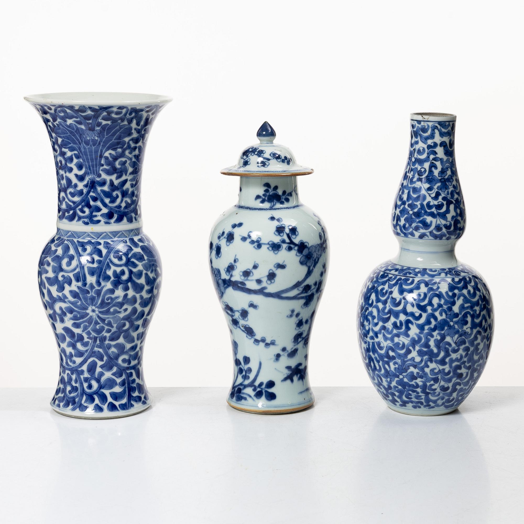 Two blue and white vases, Qing dynasty, 19th century and a blue and white vase with cover, 18th century.
